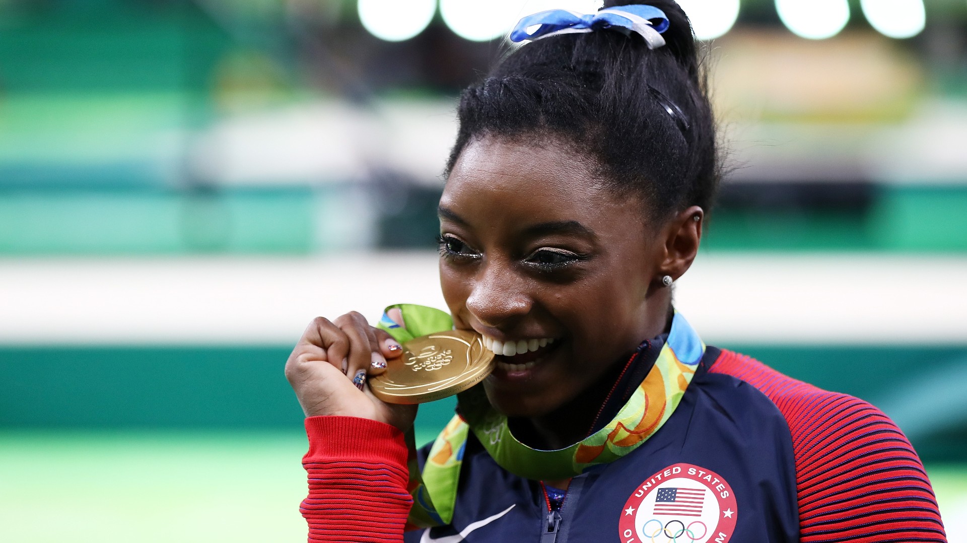 Why do Olympians bite their medals?